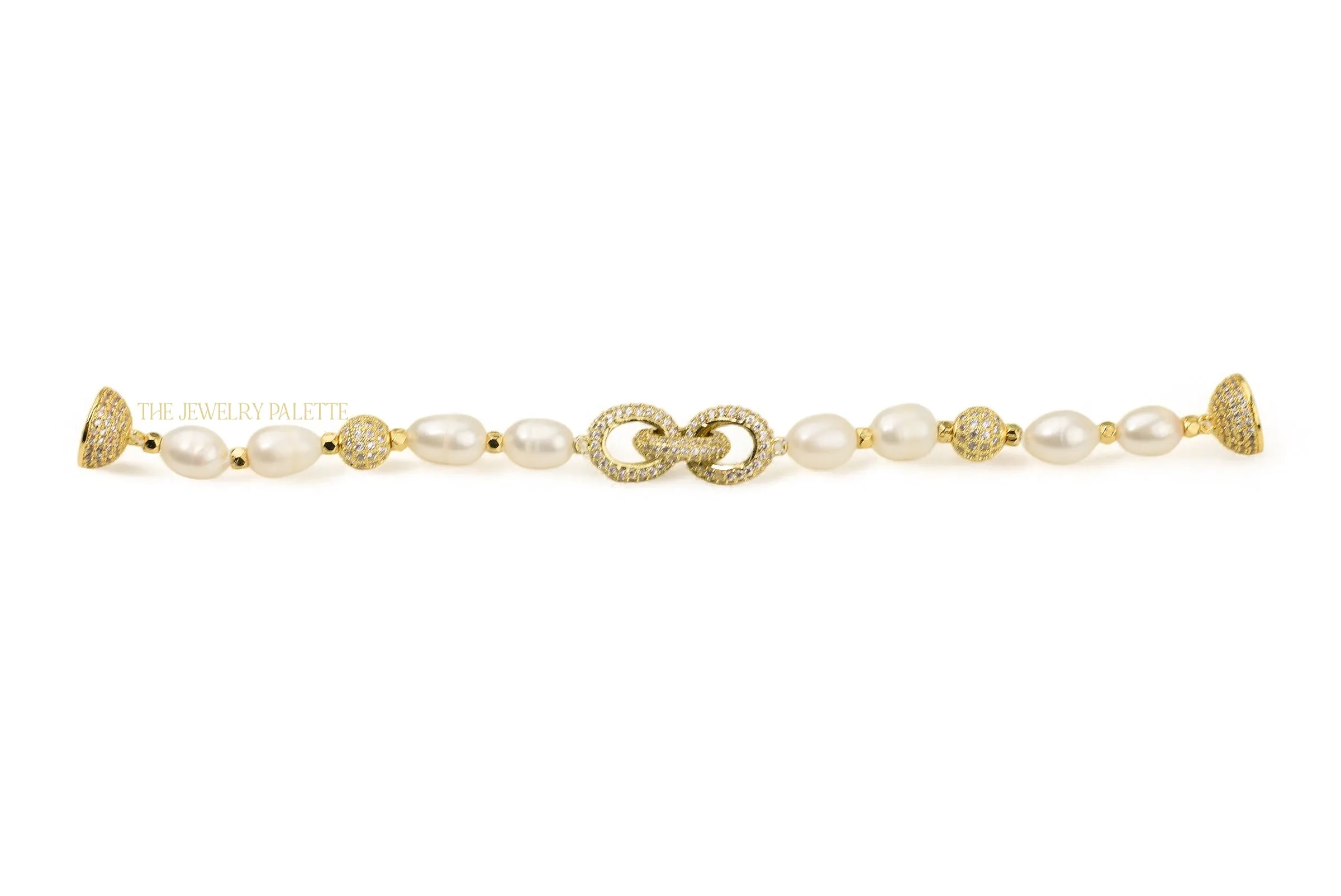 Adele white freshwater pearl bracelet with interlocking gold centerpiece