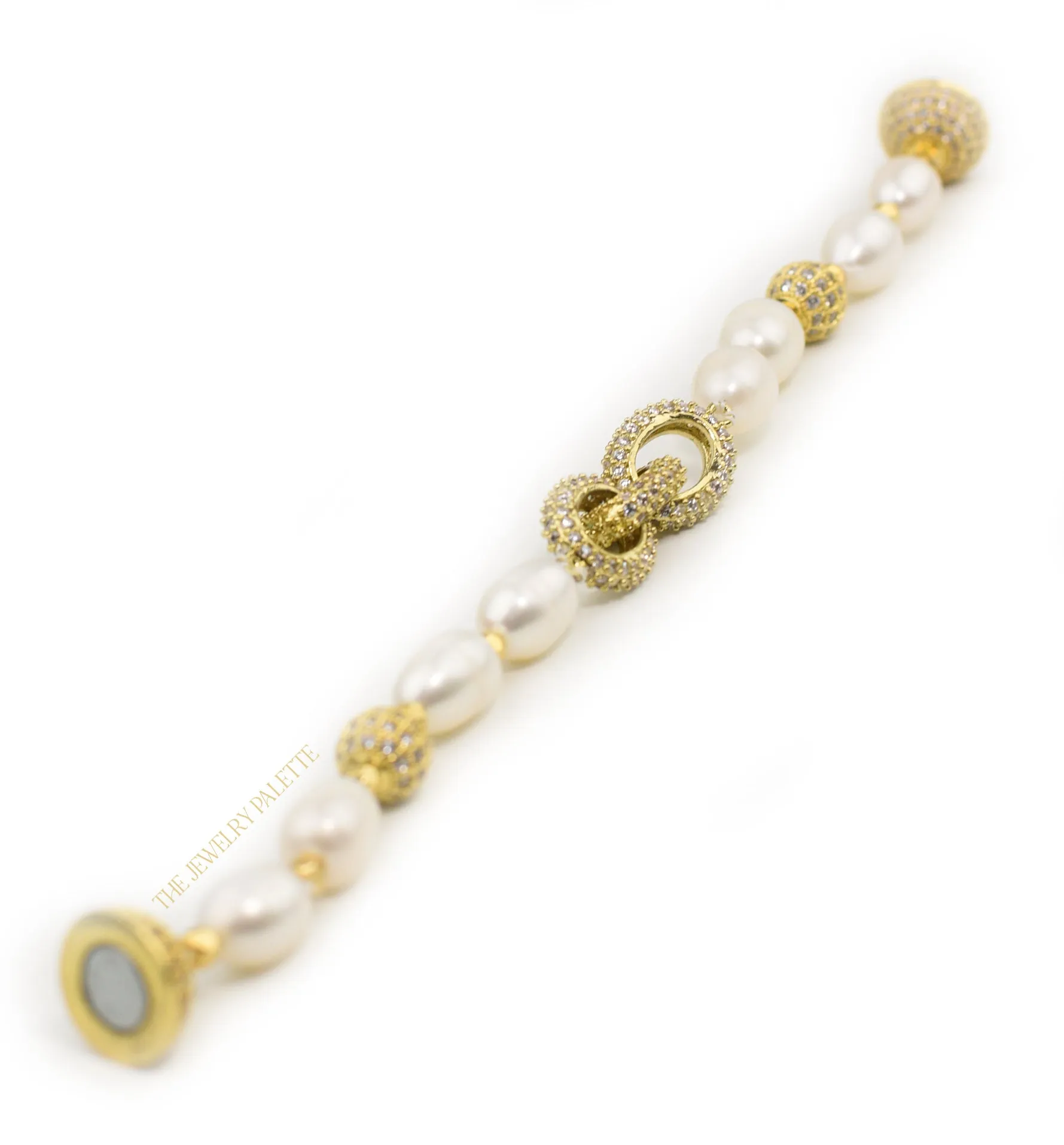 Adele white freshwater pearl bracelet with interlocking gold centerpiece